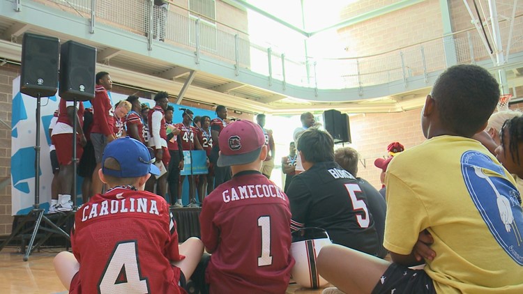 The Pigskin Poets spend Friday giving back to the community by spending time with area youngsters