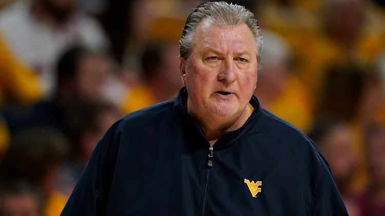 Bob Huggins says he never resigned as West Virginias coach and wants his job back attorney claims