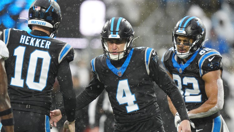 Panthers score win No 2 in pouring rain over Falcons