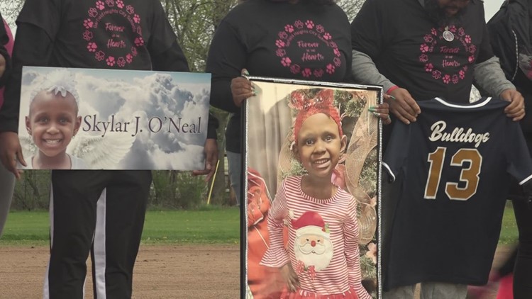 Softball team makes heartfelt tribute to young fan lost to cancer