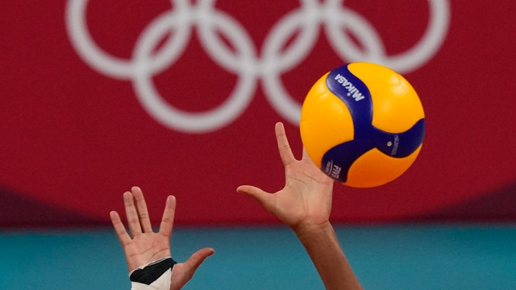 Why does one volleyball player wear a different color jersey at the Olympics