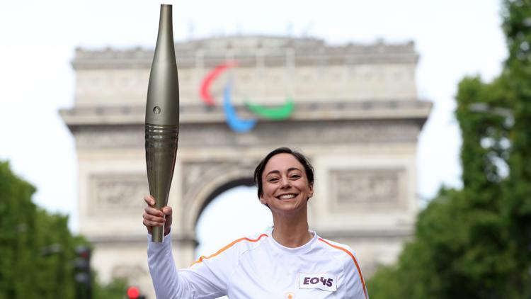 Who is carrying the Olympic torch through Paris A BTS star a garbage collector and more