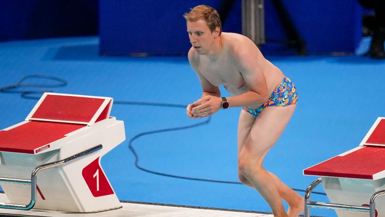 Main character energy Pool worker saves the day retrieves swim cap from Olympic pool