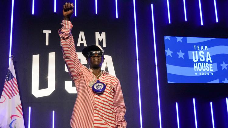 Flavor Flav is soaking up his 1st Olympic experience cheering on the US water polo teams