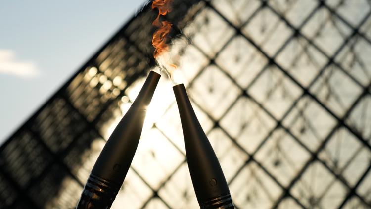 Who will light the Olympic cauldron at the Opening Ceremony