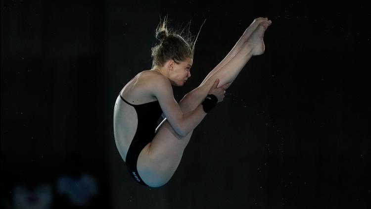 Why do divers shower after they dive at the Paris Olympics