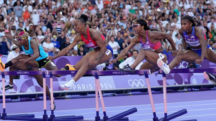 US runner finishes neck and neck for gold in 100m hurdles