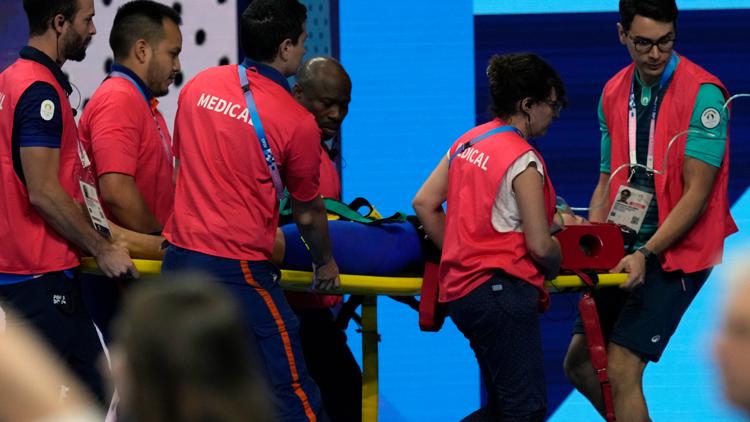 Swimmer Tamara Potocka collapses after a womens 200 meter individual medley race at the Olympics