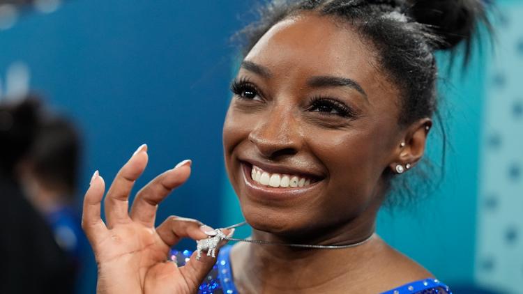 Simone Biles rocks GOAT necklace as she won gold medal for womens all around at 2024 Paris Olympics