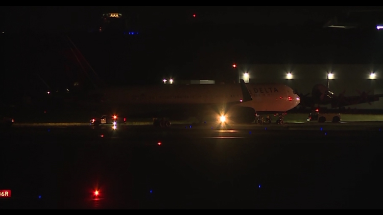 Delta flight carrying Carolina Panthers runs off taxiway at Charlotte airport no one hurt