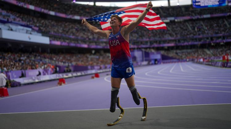 Hunter Woodhall wins Paralympic sprint title to join his wife as a gold medalist