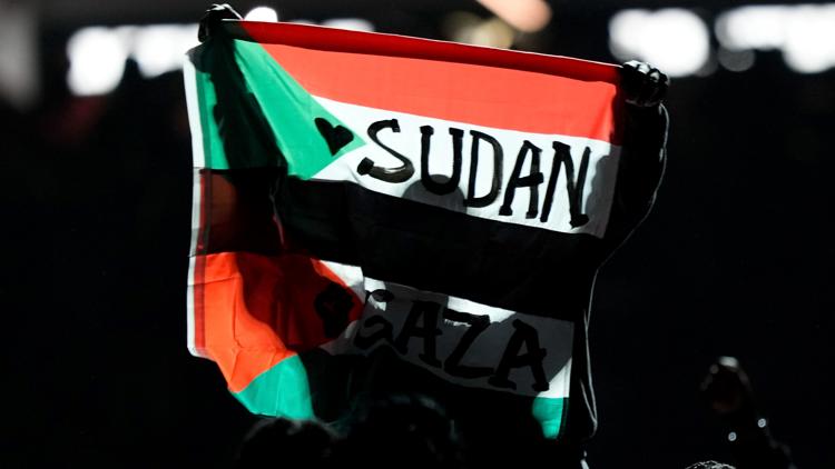 Super Bowl halftime performer detained after unfurling Sudan Palestine flag