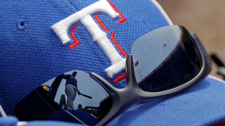 Those awkwardly-designed Rangers hats are selling for a lot of cash on eBay