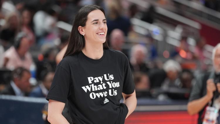 WNBA players wear pay us what you owe us shirts before All Star game