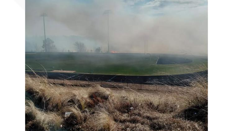 Brush fire behind White Knoll High School contained no structure damage injuries reported
