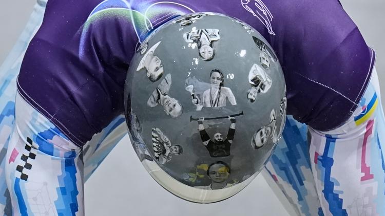 Ukrainian Olympian vows to wear helmet honoring killed athletes even though officials banned it