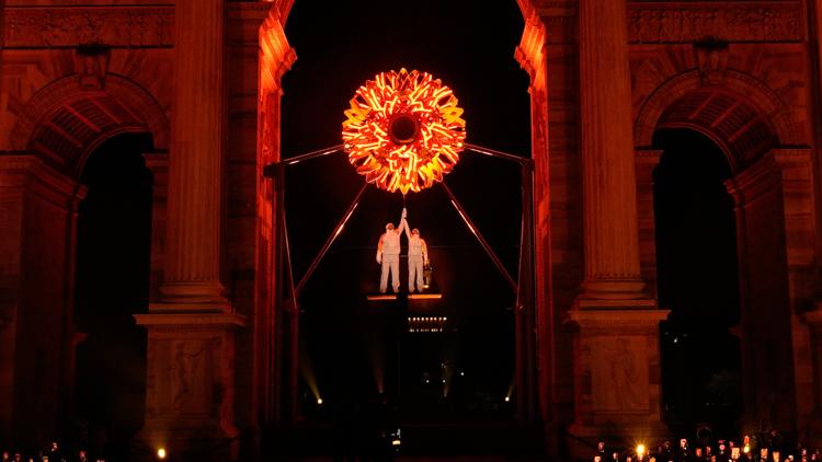 Who lit the Olympic cauldrons at the Opening Ceremony