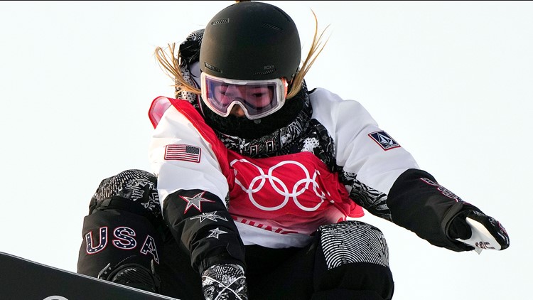Why are Olympic snowboarders tucking their number bibs under their arms