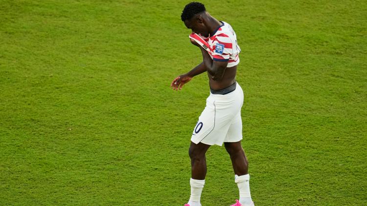 US forward Folarin Balogun reacts to red card in World Cup knockout game